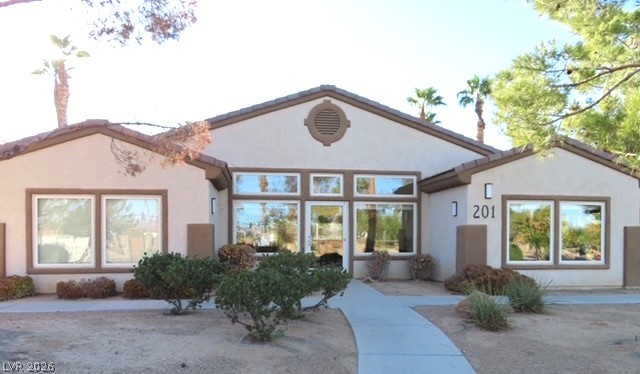 1623 Cave Spring Drive Henderson, NV 89014 - Photo 10 of 16 A desert oasis awaits, featuring a low-maintenance landscape and an inviting entry.
