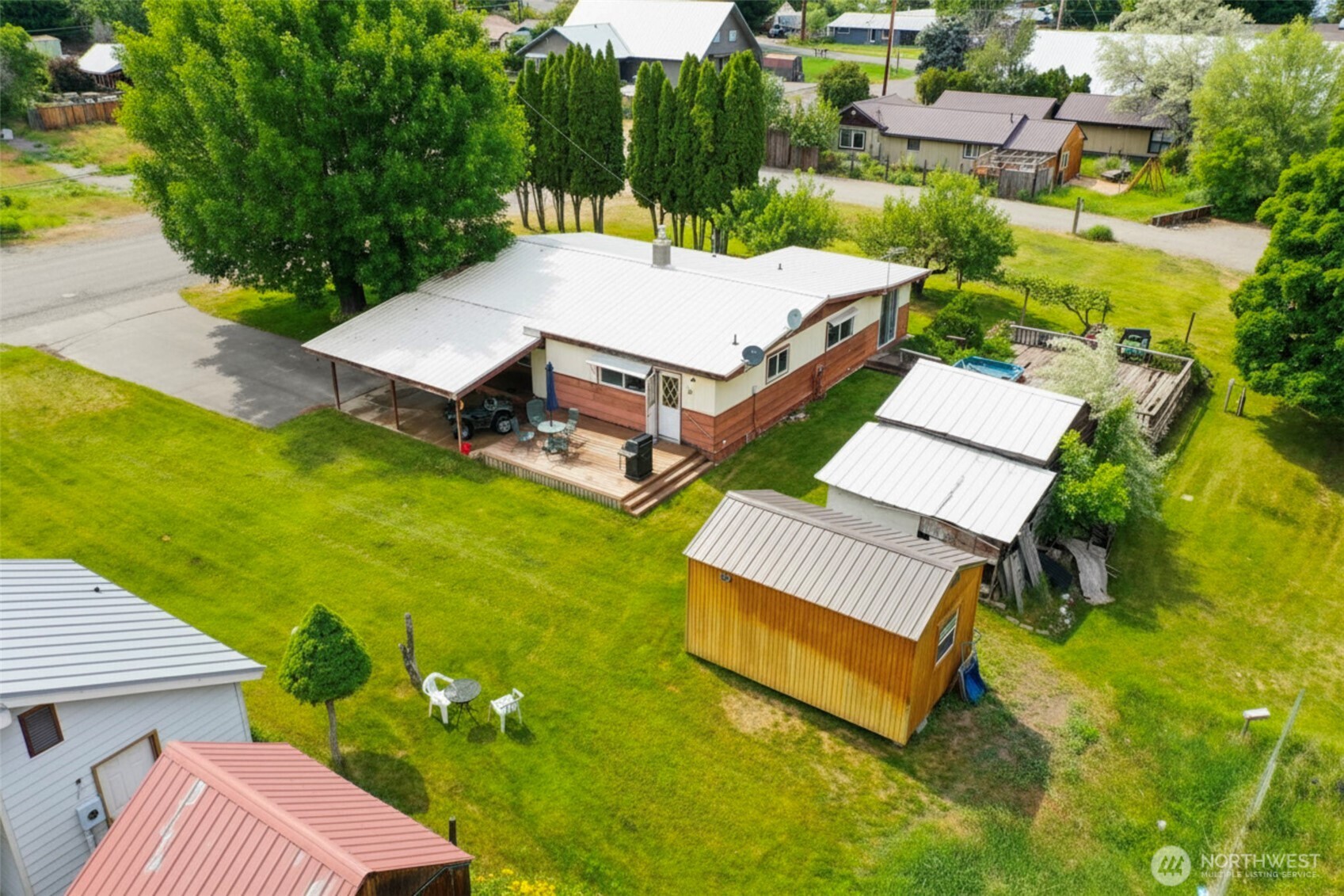518 Bridge Street Twisp, WA 98856 - Photo 34 of 40 an aerial view of a house with swimming pool garden view and a yard