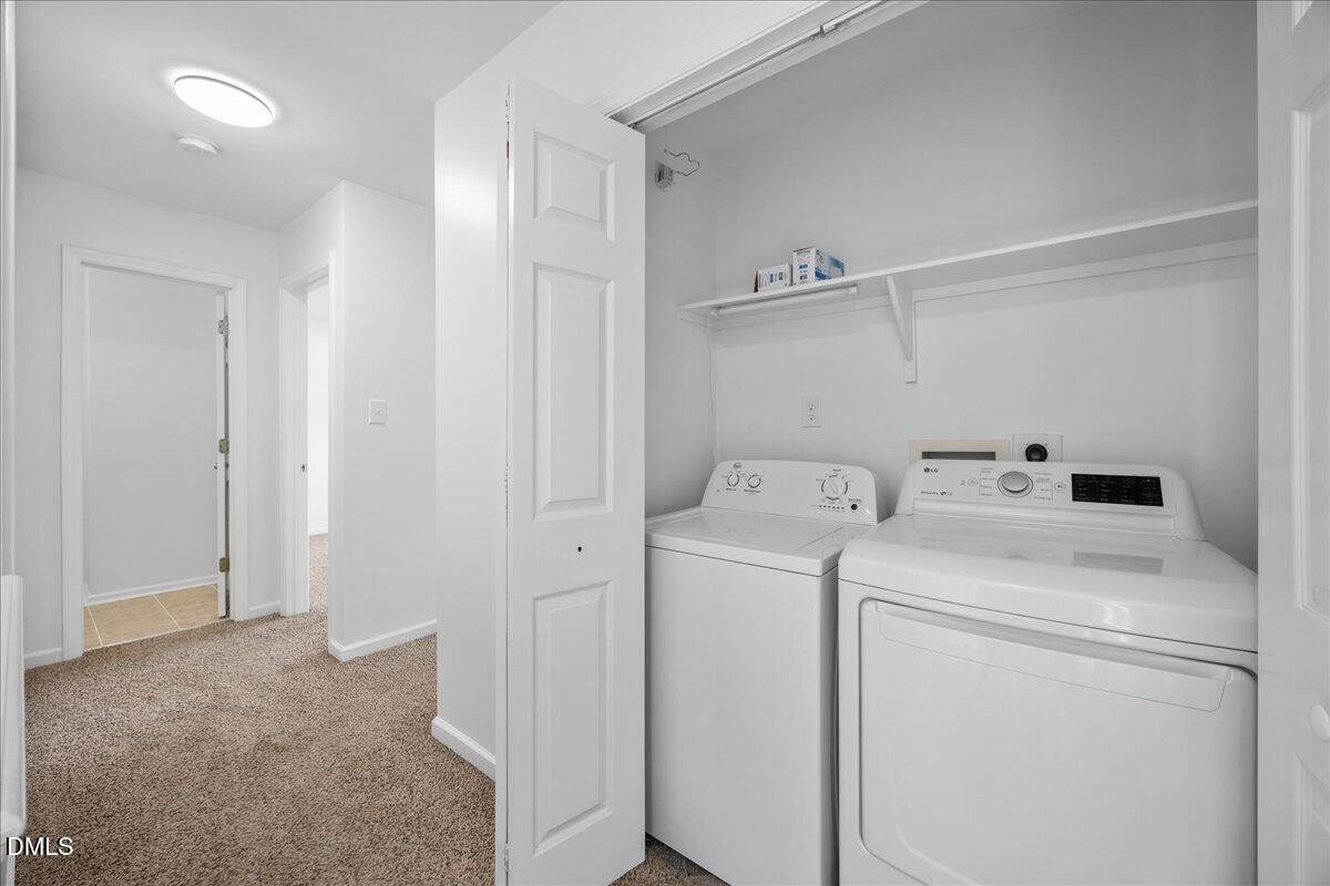 3831 Pin Oak Road Raleigh, NC 27604 - Photo 16 of 24 a view of storage and utility room with washer and dryer