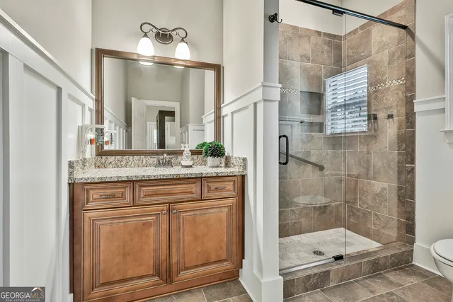 a view of livingroom with hardwood floor and a ceiling fan