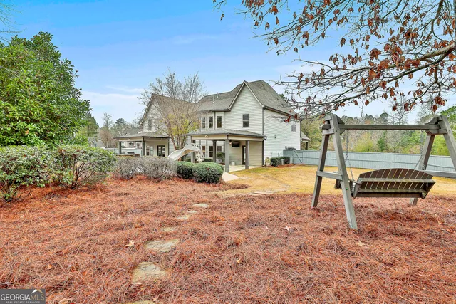 a view of a swimming pool with a patio