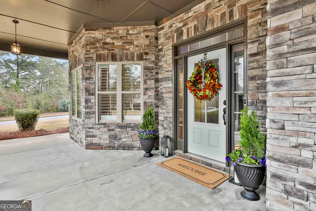 a front view of a building with outdoor seating