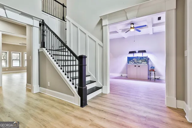 a view of a hallway view with staircase