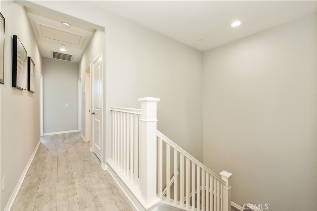 68 Origin Irvine, CA 92618 - Photo 35 of 43 a view of a hallway with wooden floor and entryway
