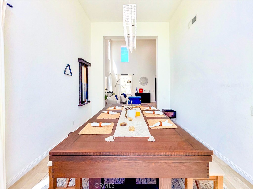25714 Wallace Place Stevenson Ranch, CA 91381 - Photo 6 of 24 a room with table and chairs