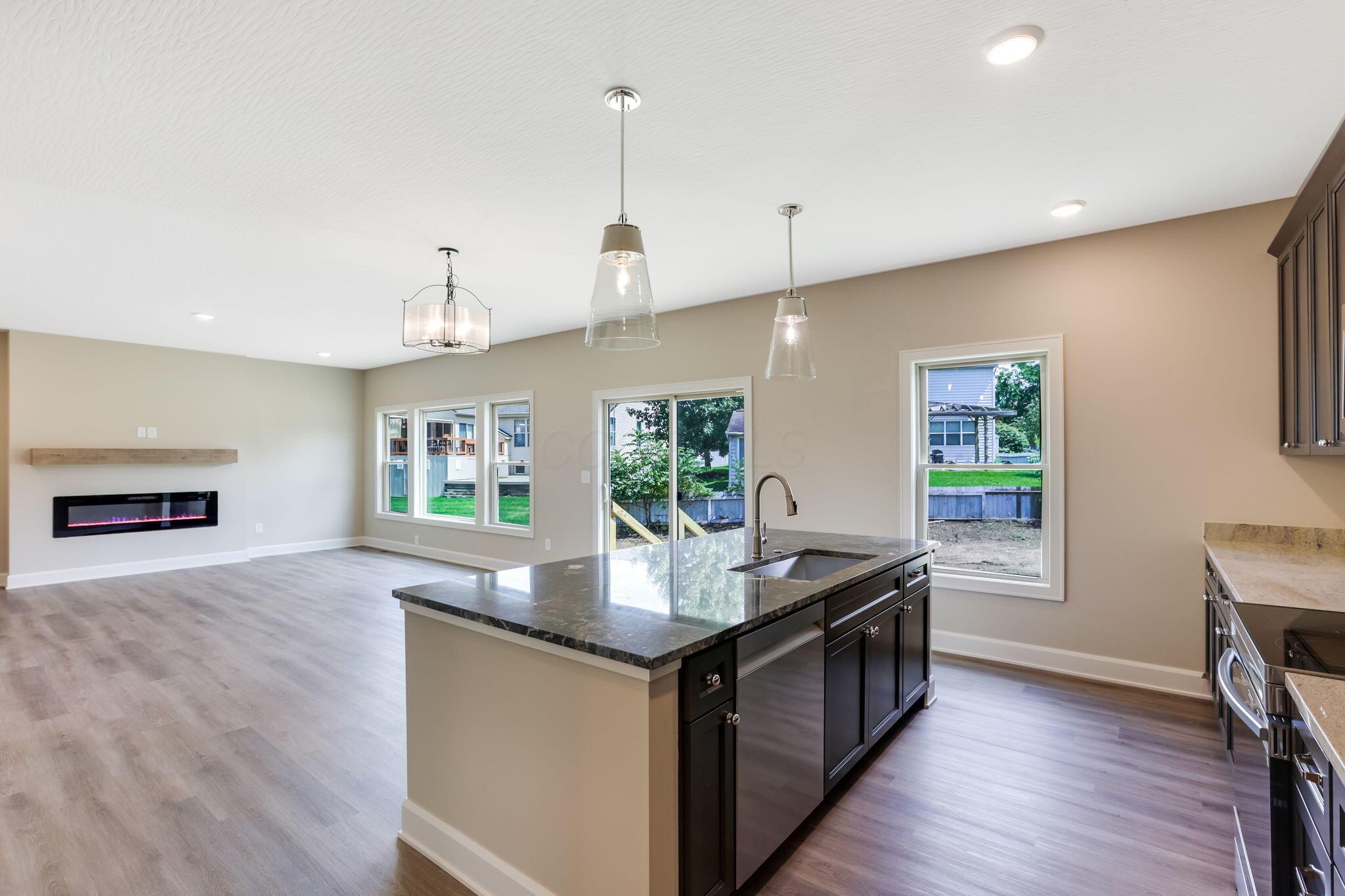 9007 Columbia Road Southwest Pataskala, OH 43062 - Photo 22 of 70 Open kitchen into eat-in space & Great room