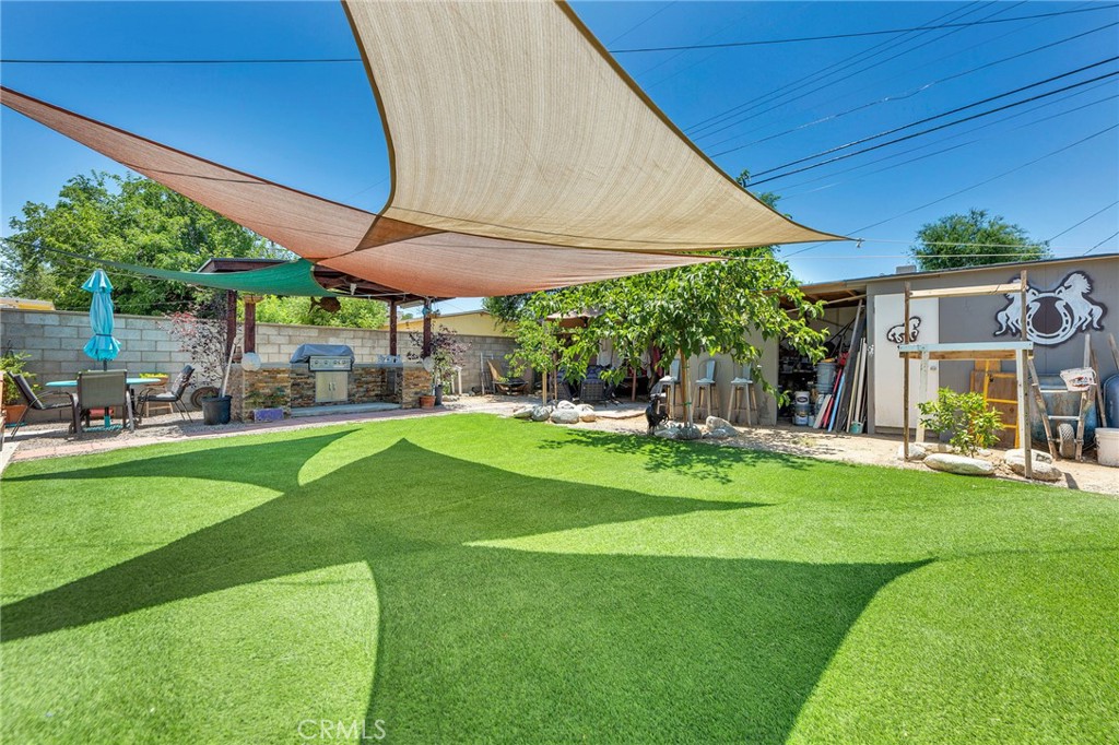 44309 Hardwood Avenue Lancaster, CA 93534 - Photo 24 of 34 turf in backyard