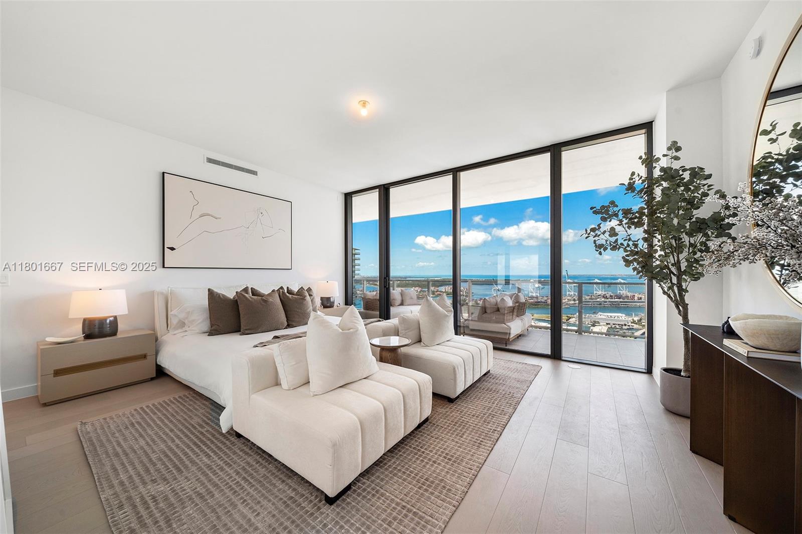 500 Alton Road, Unit 3602 Miami Beach, FL 33139 - Photo 12 of 33 a living room with furniture and a large window with outer view