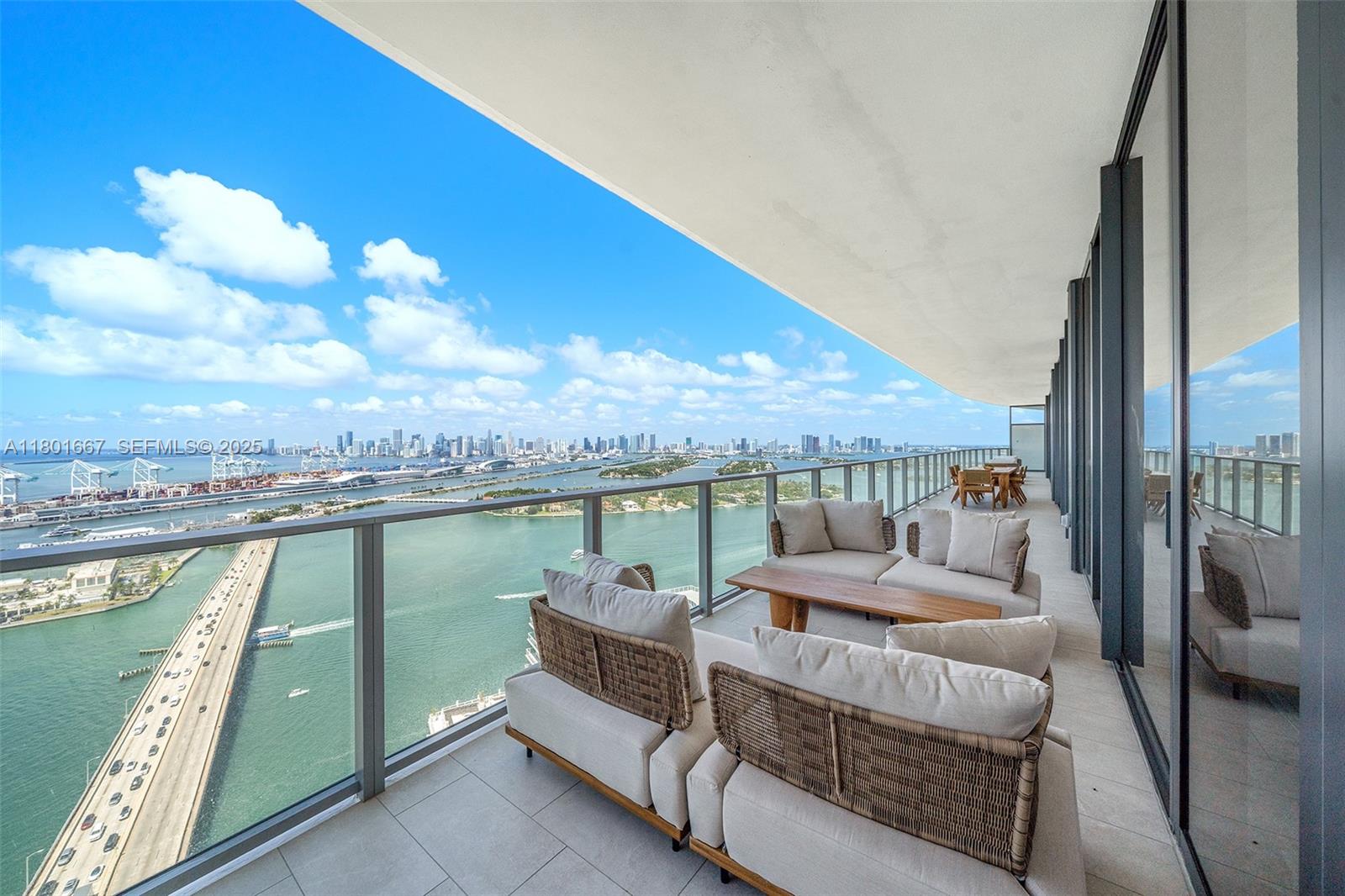 500 Alton Road, Unit 3602 Miami Beach, FL 33139 - Photo 13 of 33 a balcony with furniture