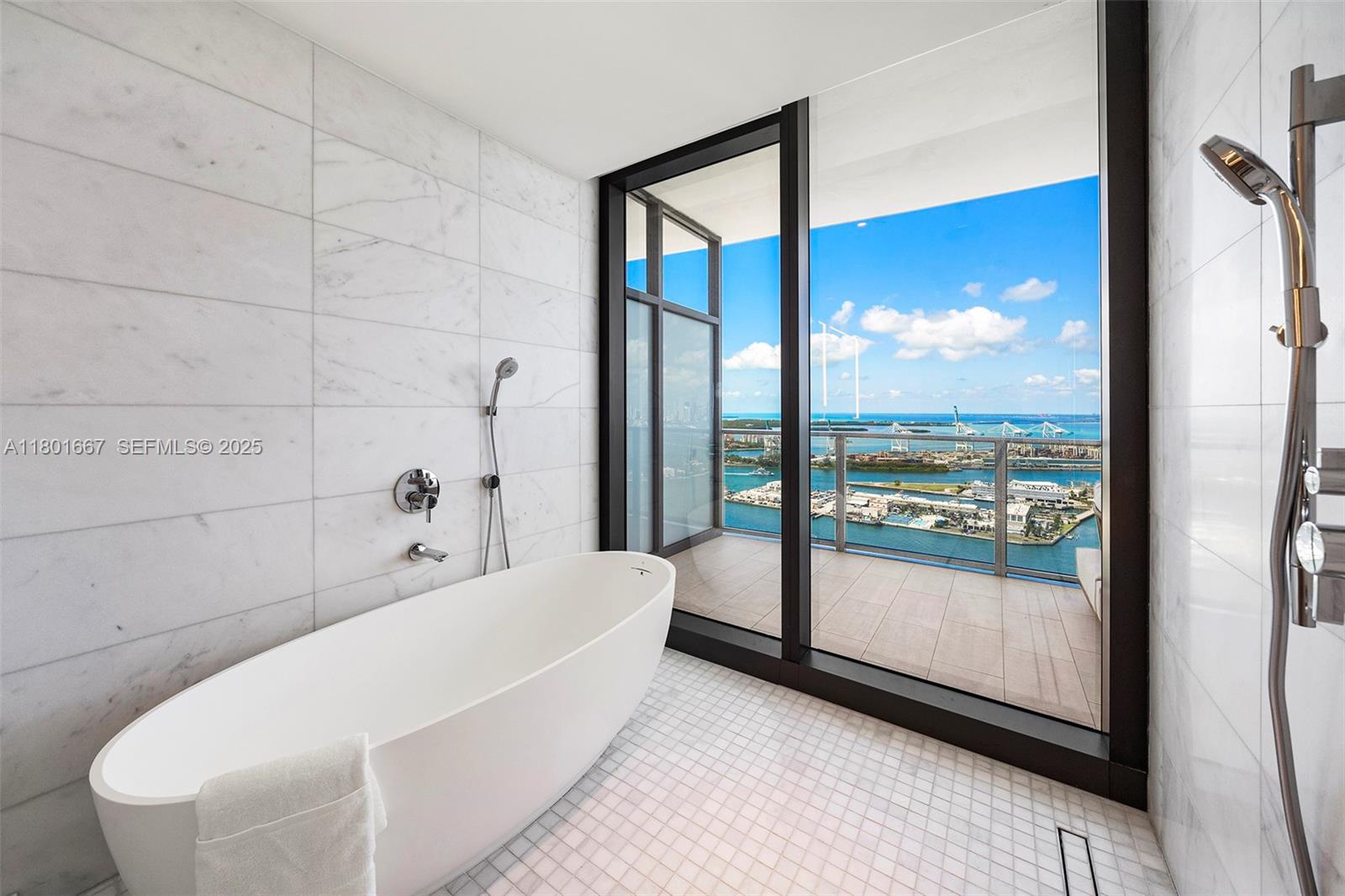 500 Alton Road, Unit 3602 Miami Beach, FL 33139 - Photo 17 of 33 a bathroom with a bathtub and a shower