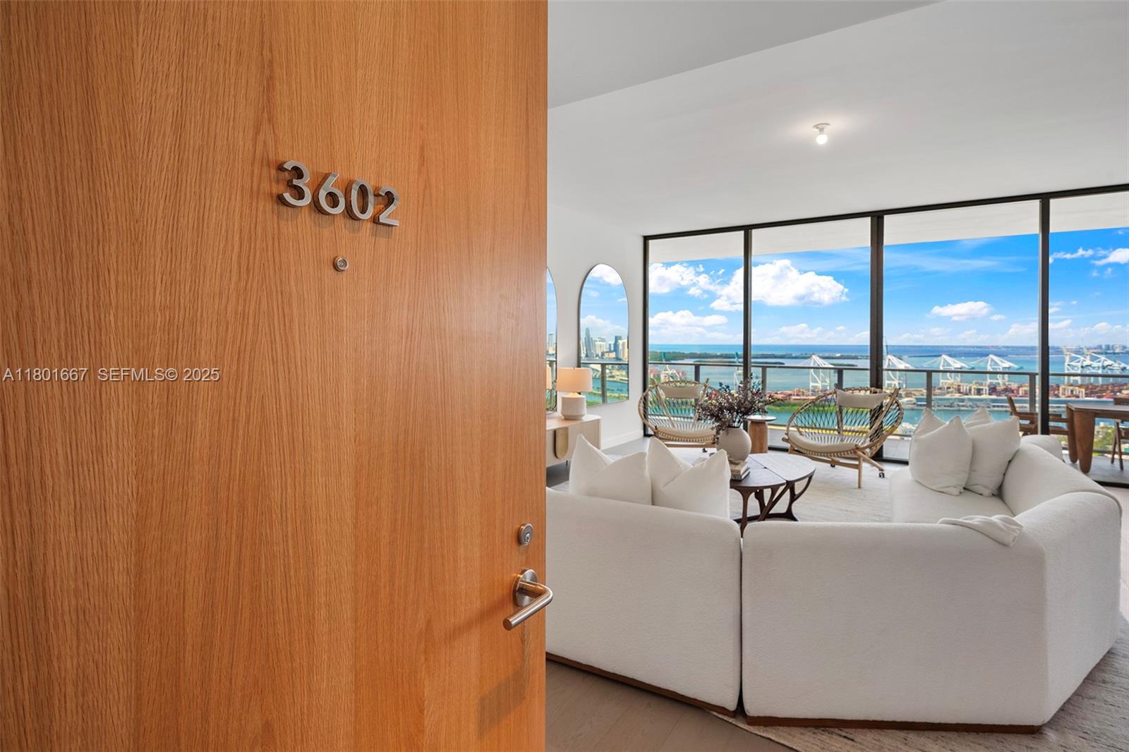 500 Alton Road, Unit 3602 Miami Beach, FL 33139 - Photo 28 of 33 a living room with furniture and a large window