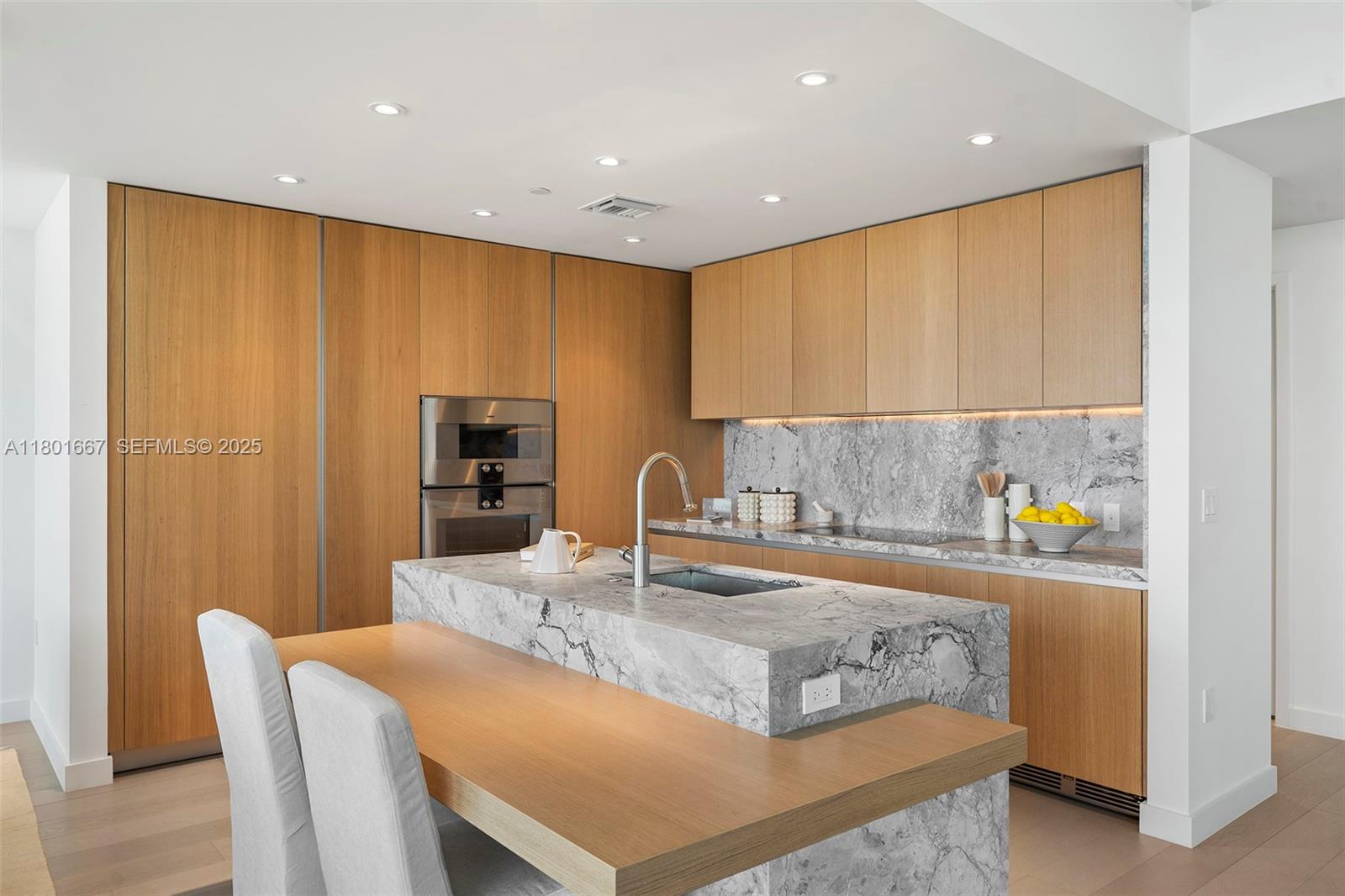 500 Alton Road, Unit 3602 Miami Beach, FL 33139 - Photo 6 of 33 a kitchen with granite countertop sink and cabinets