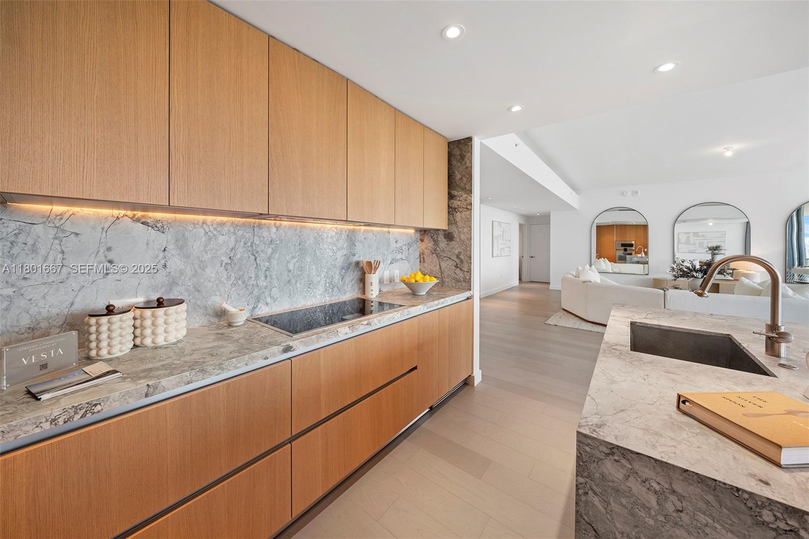 500 Alton Road, Unit 3602 Miami Beach, FL 33139 - Photo 8 of 33 a large kitchen with stainless steel appliances granite countertop a sink and cabinets