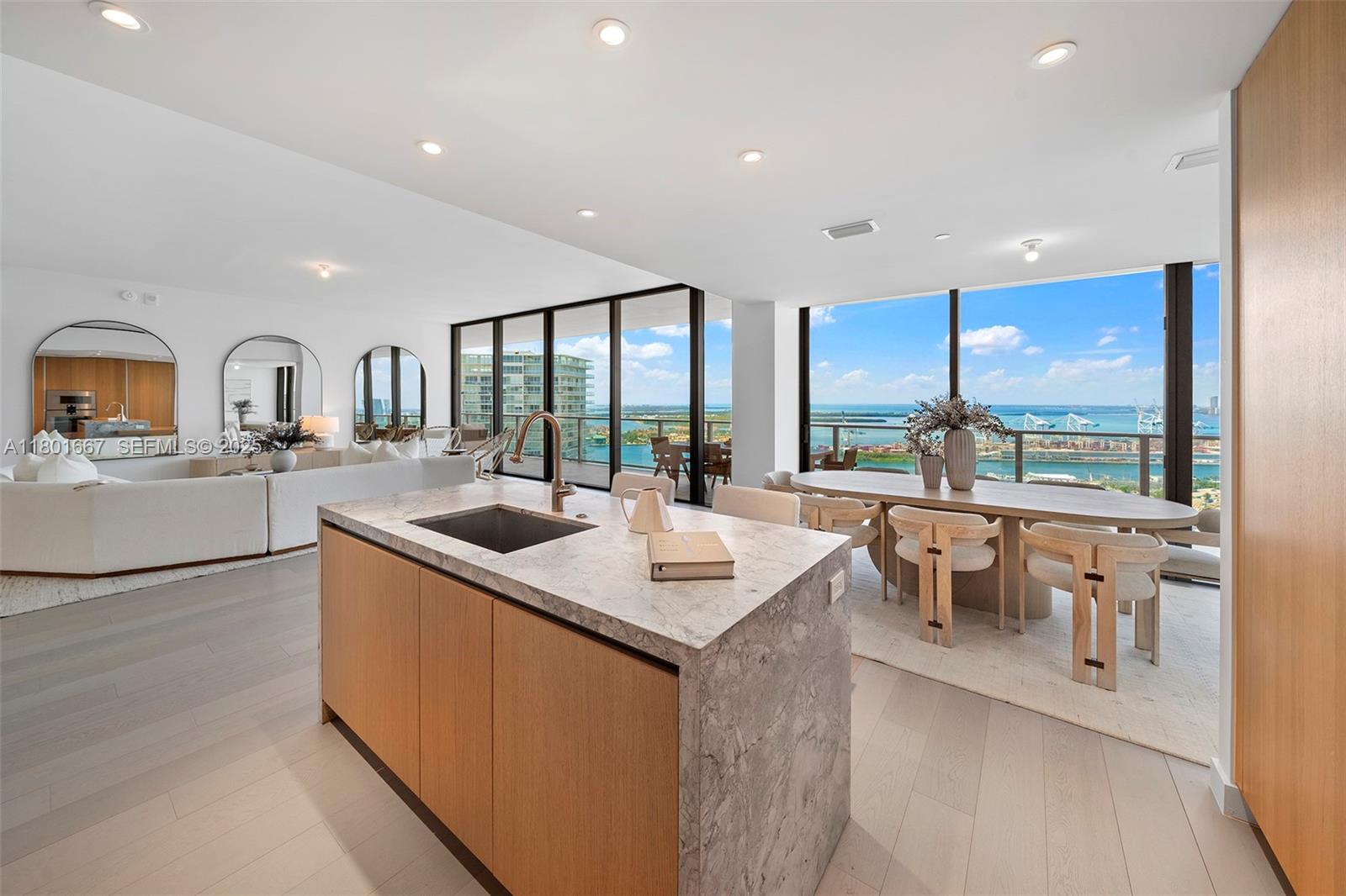 500 Alton Road, Unit 3602 Miami Beach, FL 33139 - Photo 9 of 33 a kitchen with stainless steel appliances granite countertop a sink a stove and a refrigerator