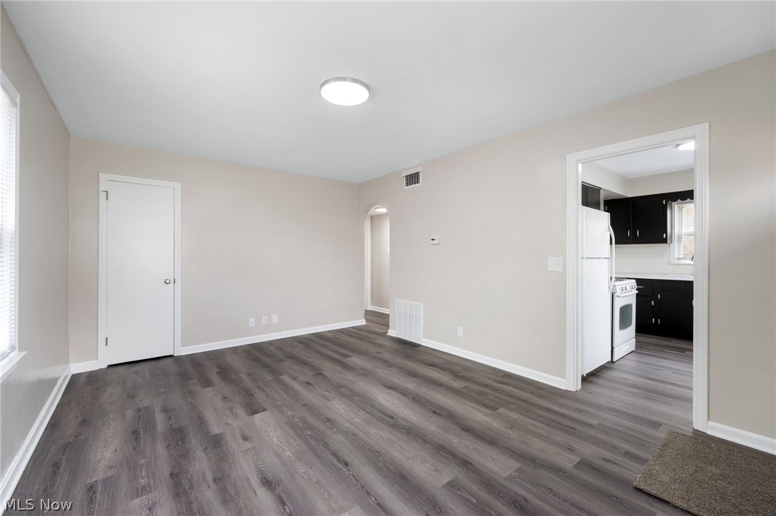 878 Reed Avenue Akron, OH 44306 - Photo 3 of 29 Spare room with dark hardwood / wood-style floors