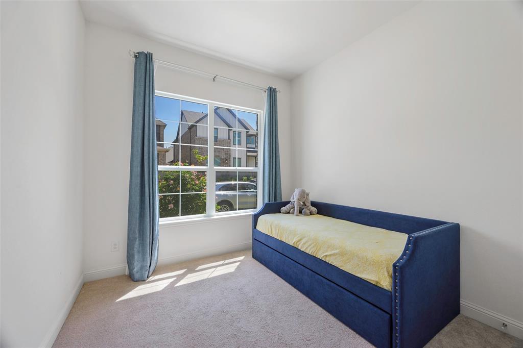3603 Scotsman Road Sachse, TX 75048 - Photo 23 of 33 a bed sitting in a room next to a window