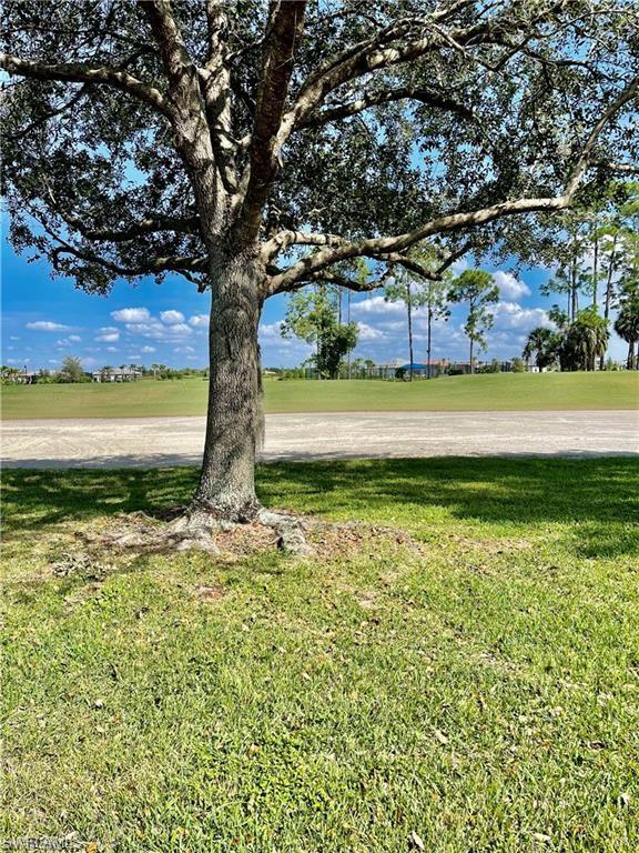 2132 Par Drive Naples, FL 34120 - Photo 13 of 15 a view of an outdoor space with a lake view