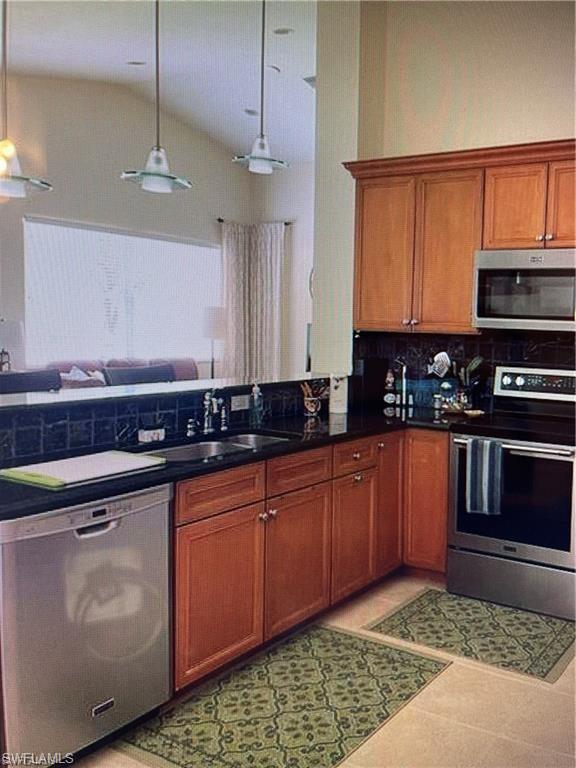 2132 Par Drive Naples, FL 34120 - Photo 4 of 15 a kitchen with stainless steel appliances granite countertop a stove a sink and a microwave