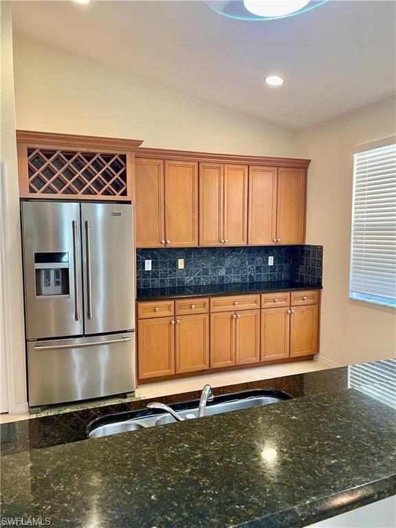 2132 Par Drive Naples, FL 34120 - Photo 6 of 15 a kitchen with a refrigerator and window