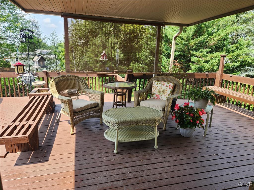 3055 Athena Drive Bethlehem, PA 18017 - Photo 2 of 6 a view of a balcony with chairs and wooden floor
