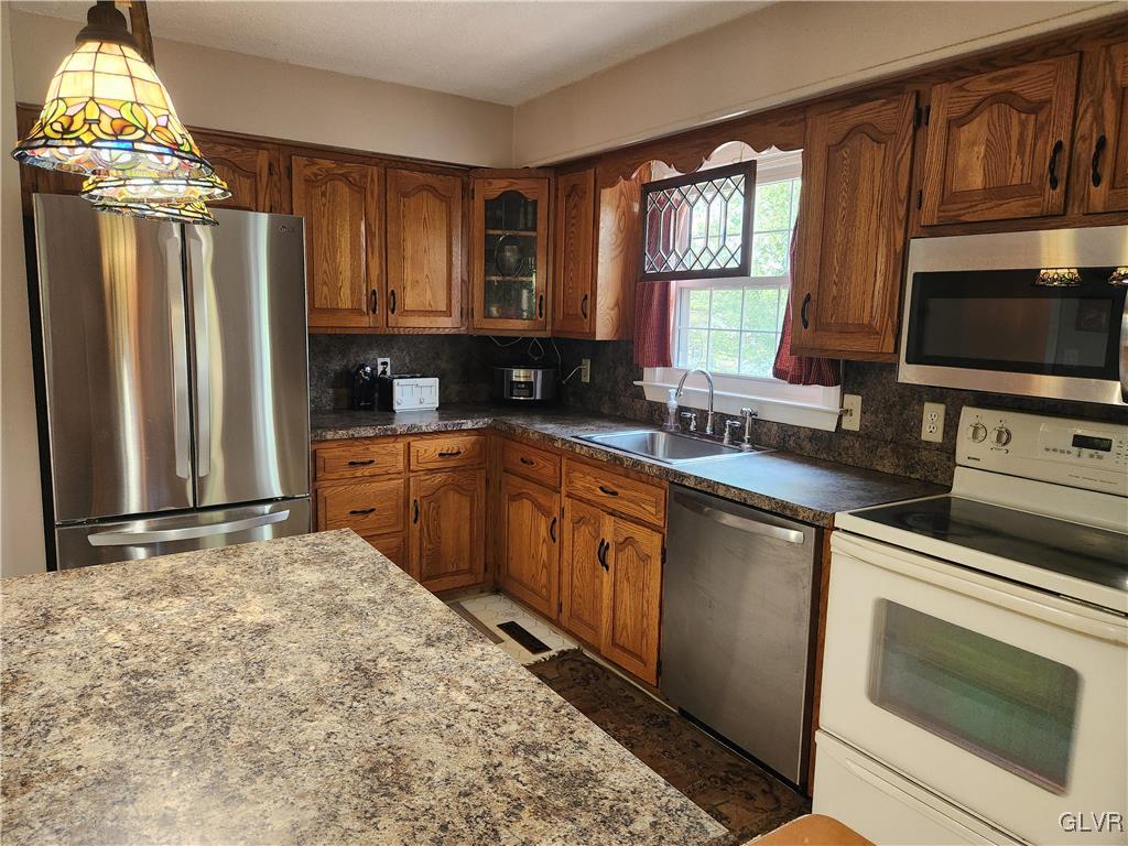 3055 Athena Drive Bethlehem, PA 18017 - Photo 5 of 6 a kitchen with granite countertop a sink stainless steel appliances and cabinets