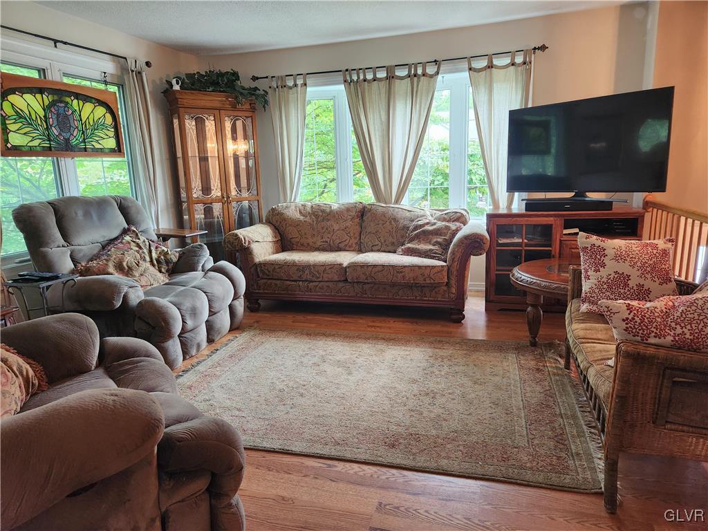 3055 Athena Drive Bethlehem, PA 18017 - Photo 6 of 6 a living room with furniture and a flat screen tv