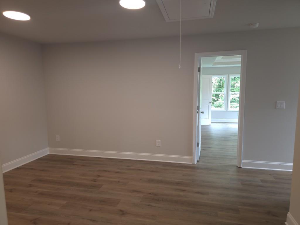 4240 Cavalier Way Duluth, GA 30097 - Photo 24 of 46 a view of wooden floor and chandelier in a room