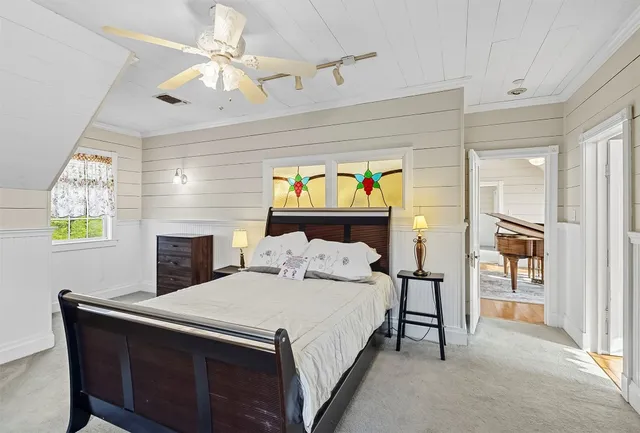 a bedroom with a bed and a fireplace