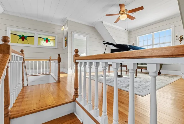 a view of an entryway wooden floor and windows