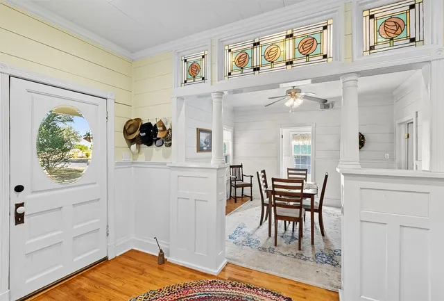 a dining room with furniture a rug and a chandelier