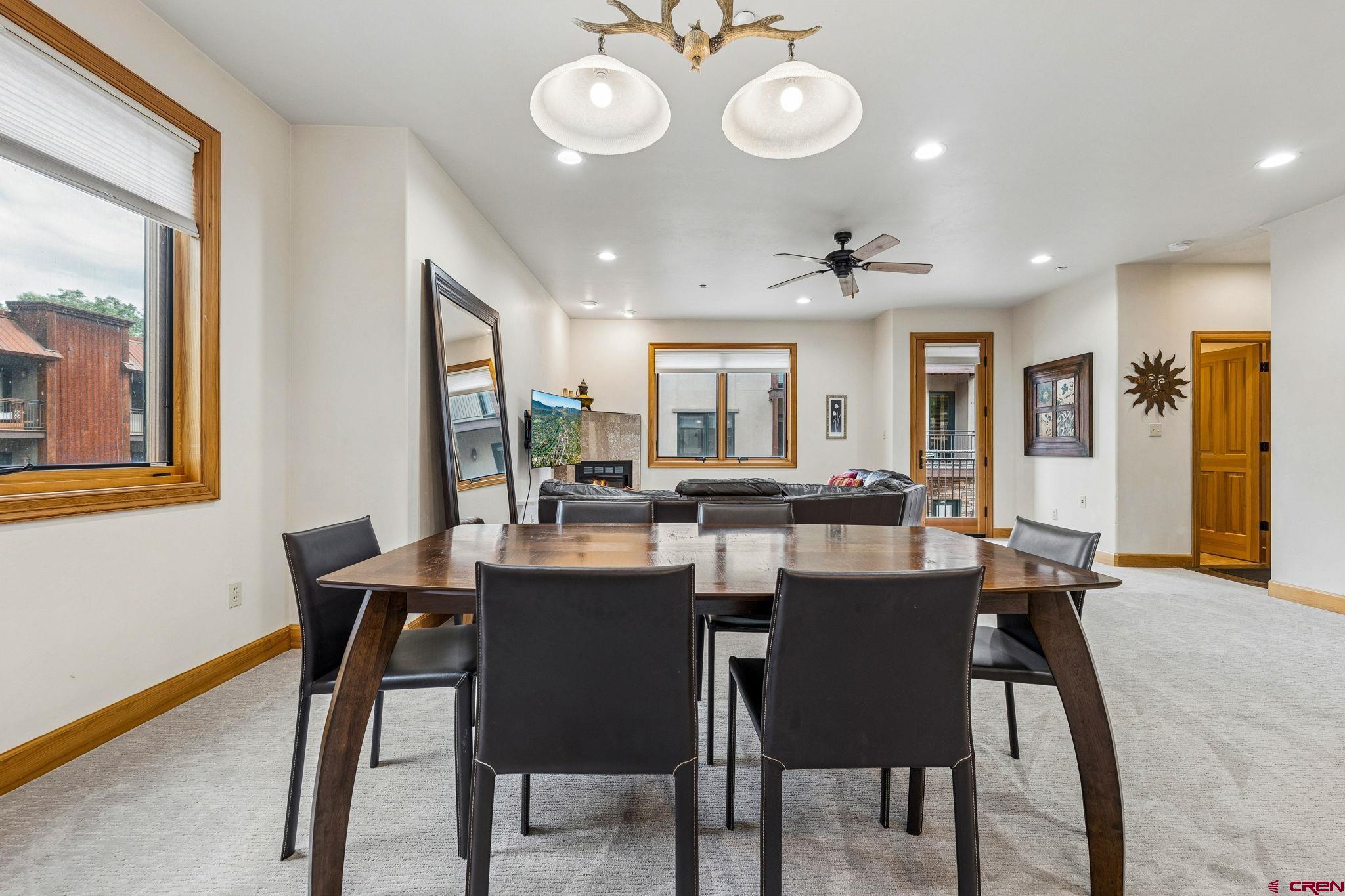 1422 Animas View Drive, Unit 55 Durango, CO 81301 - Photo 9 of 44 a view of a dining room with furniture and wooden floor