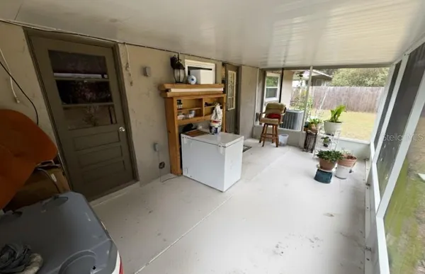 a view of a livingroom with furniture and a flat screen tv