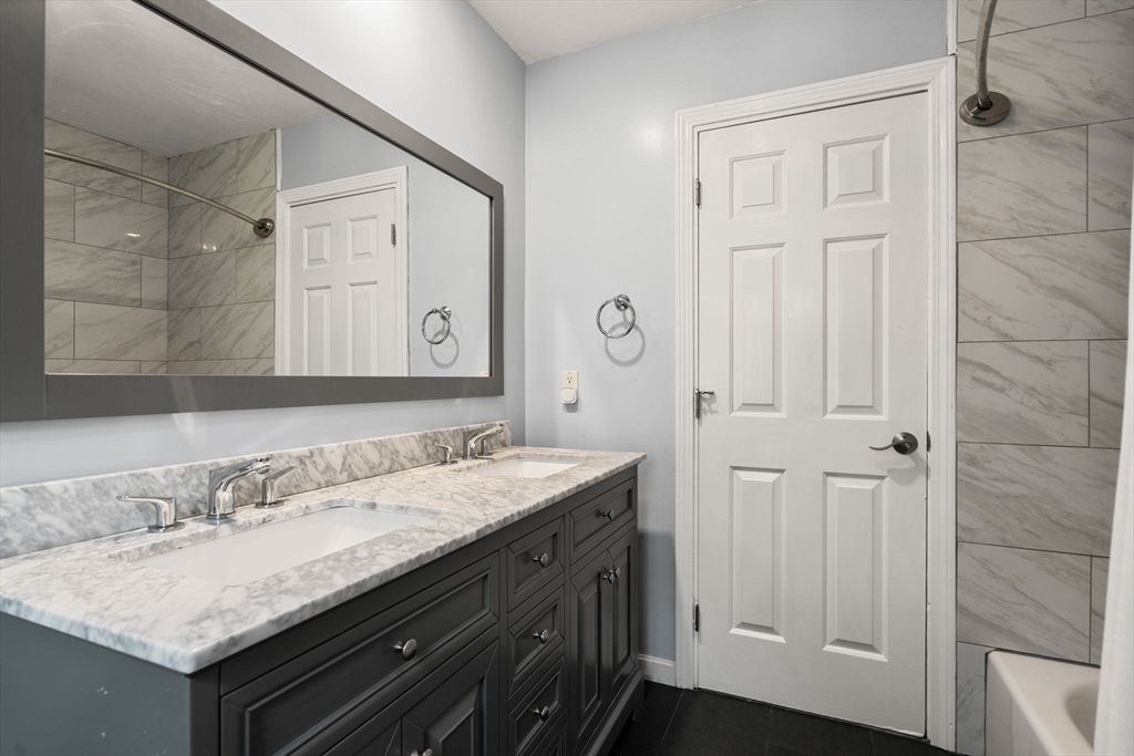 11 Cow Hill Road Sharon, MA 02067 - Photo 27 of 30 a bathroom with a granite countertop sink and a mirror