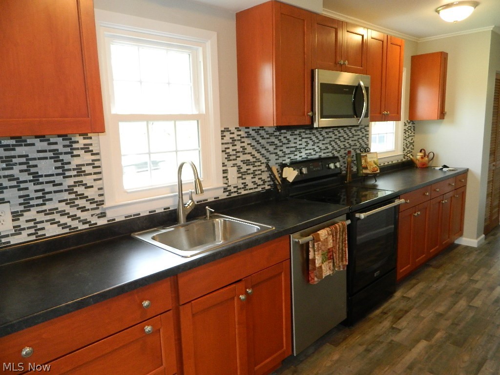 8675 Wilson Mills Road Chesterland, OH 44026 - Photo 5 of 23 Beautiful Kitchen with Custom Backsplash, an Abundance of Cabinets and Counter Space.