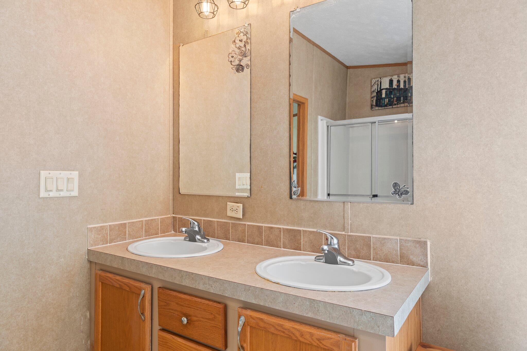 3943 Bambi Road Crestview, FL 32539 - Photo 12 of 36 a bathroom with a sink and a mirror