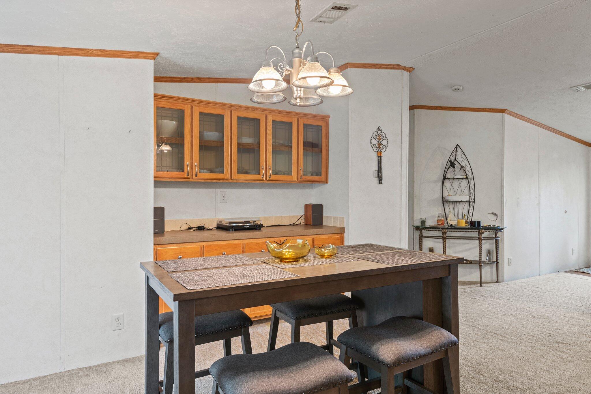 3943 Bambi Road Crestview, FL 32539 - Photo 16 of 36 a view of a dining room with furniture window and wooden floor