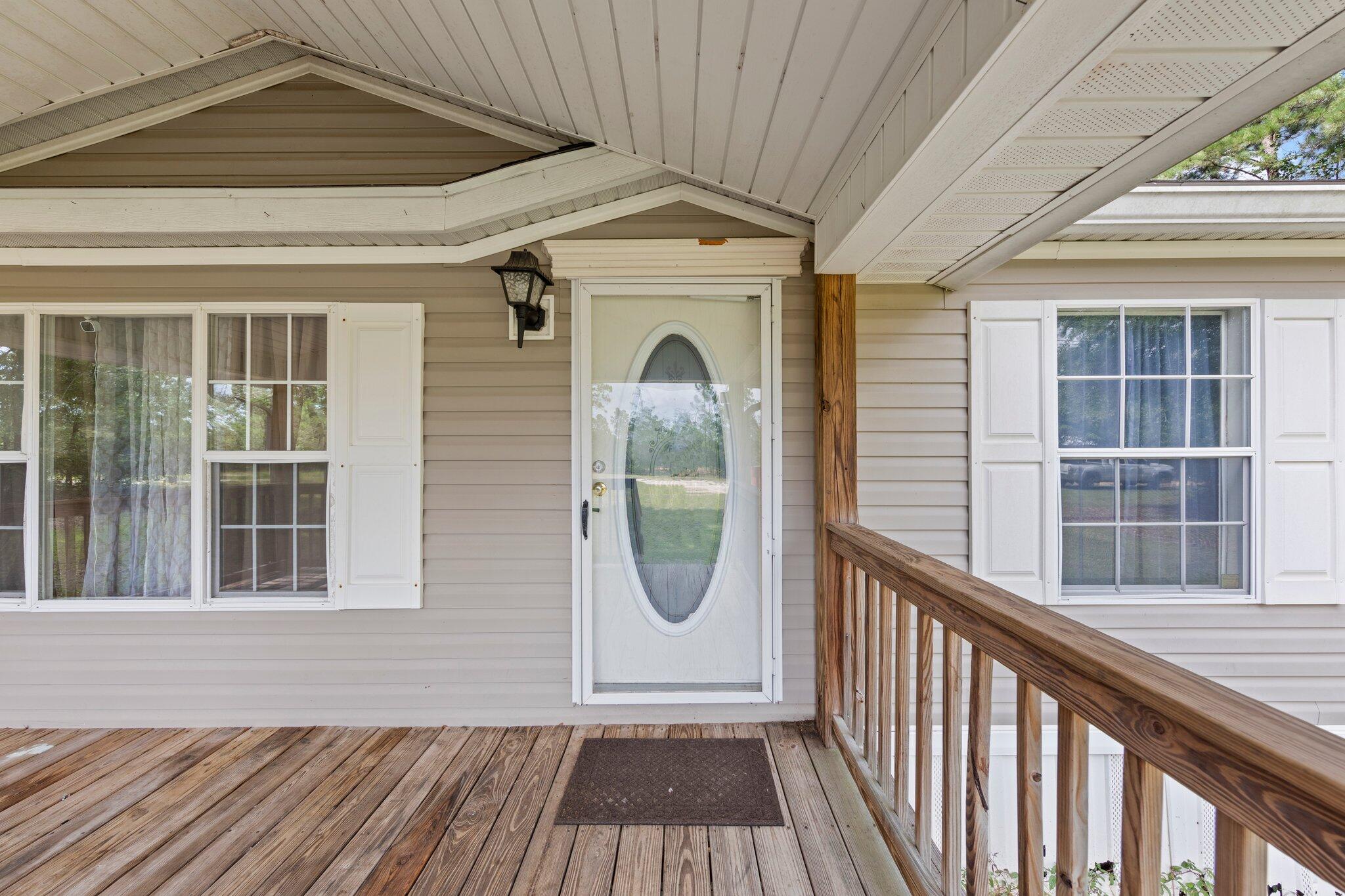 3943 Bambi Road Crestview, FL 32539 - Photo 3 of 36 a front view of a house with large windows