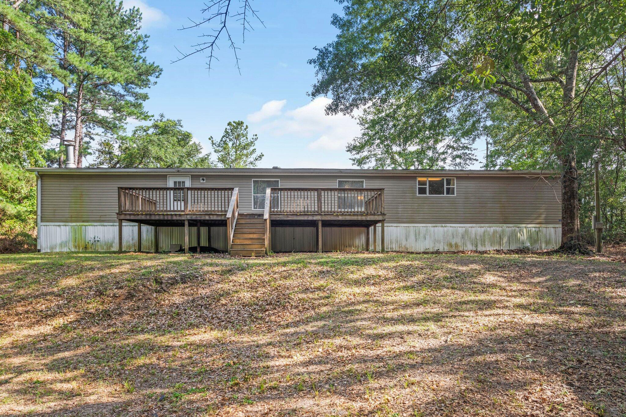 3943 Bambi Road Crestview, FL 32539 - Photo 33 of 36 a front view of a house with a garden
