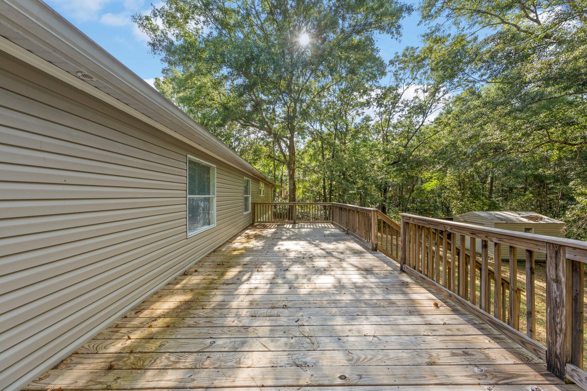 3943 Bambi Road Crestview, FL 32539 - Photo 36 of 36 a view of balcony with wooden floor and fence