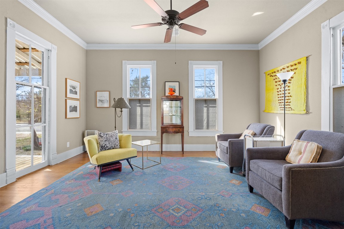 660 North Main Street La Grange, TX 78945 - Photo 9 of 24 Sitting room with wood finished floors, crown molding, and a ceiling fan