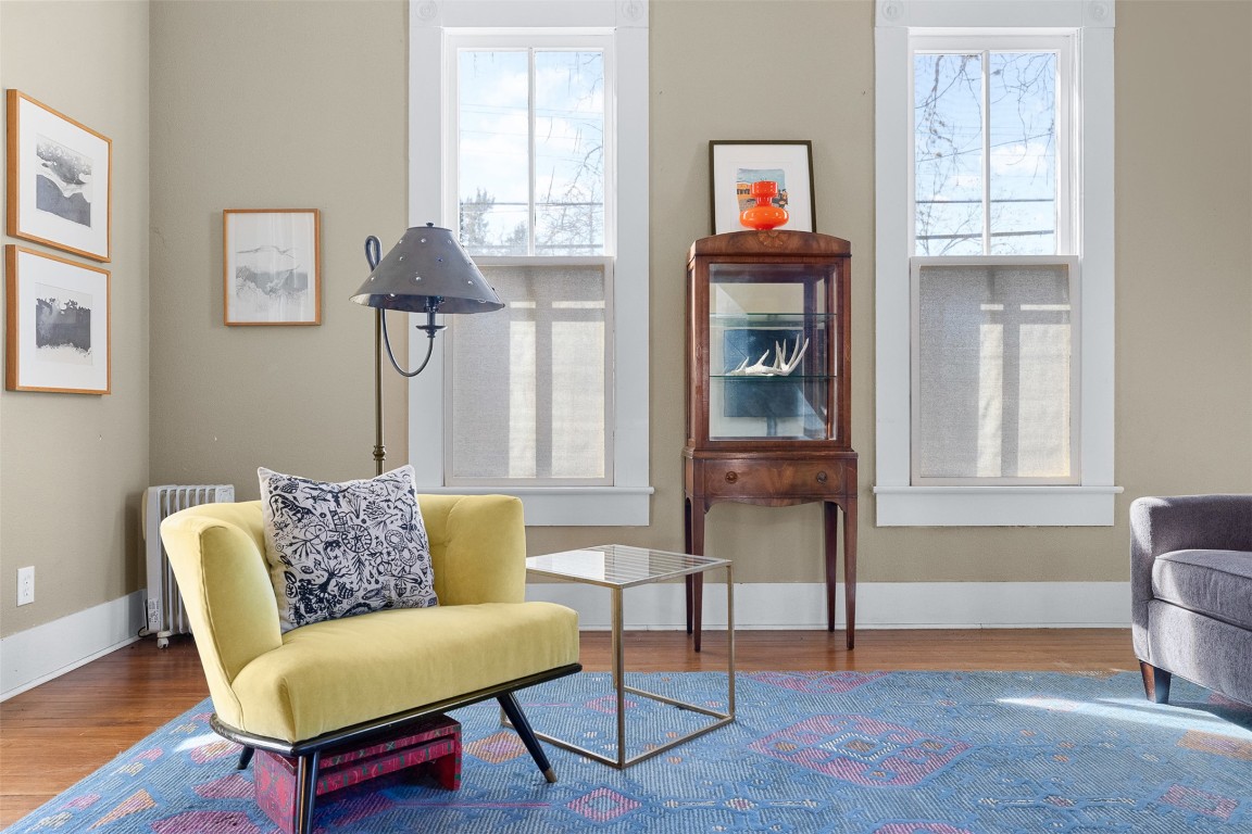 660 North Main Street La Grange, TX 78945 - Photo 10 of 24 Living area with wood finished floors and radiator