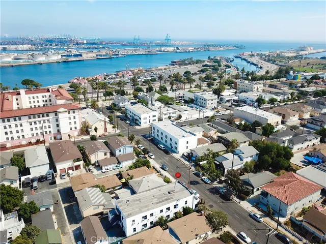 an aerial view of a city with ocean view