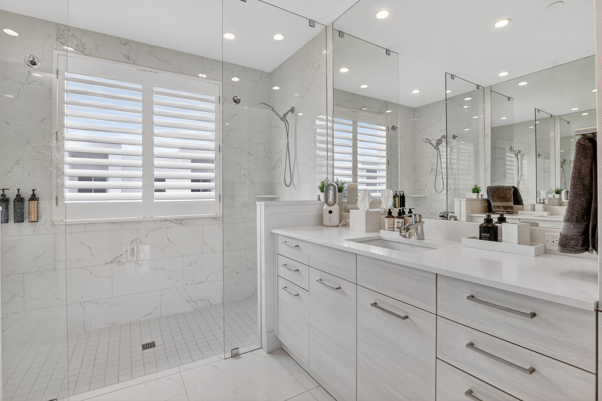4021 Northwest 18th Way Boca Raton, FL 33431 - Photo 28 of 37 a bathroom with a shower sink and mirror