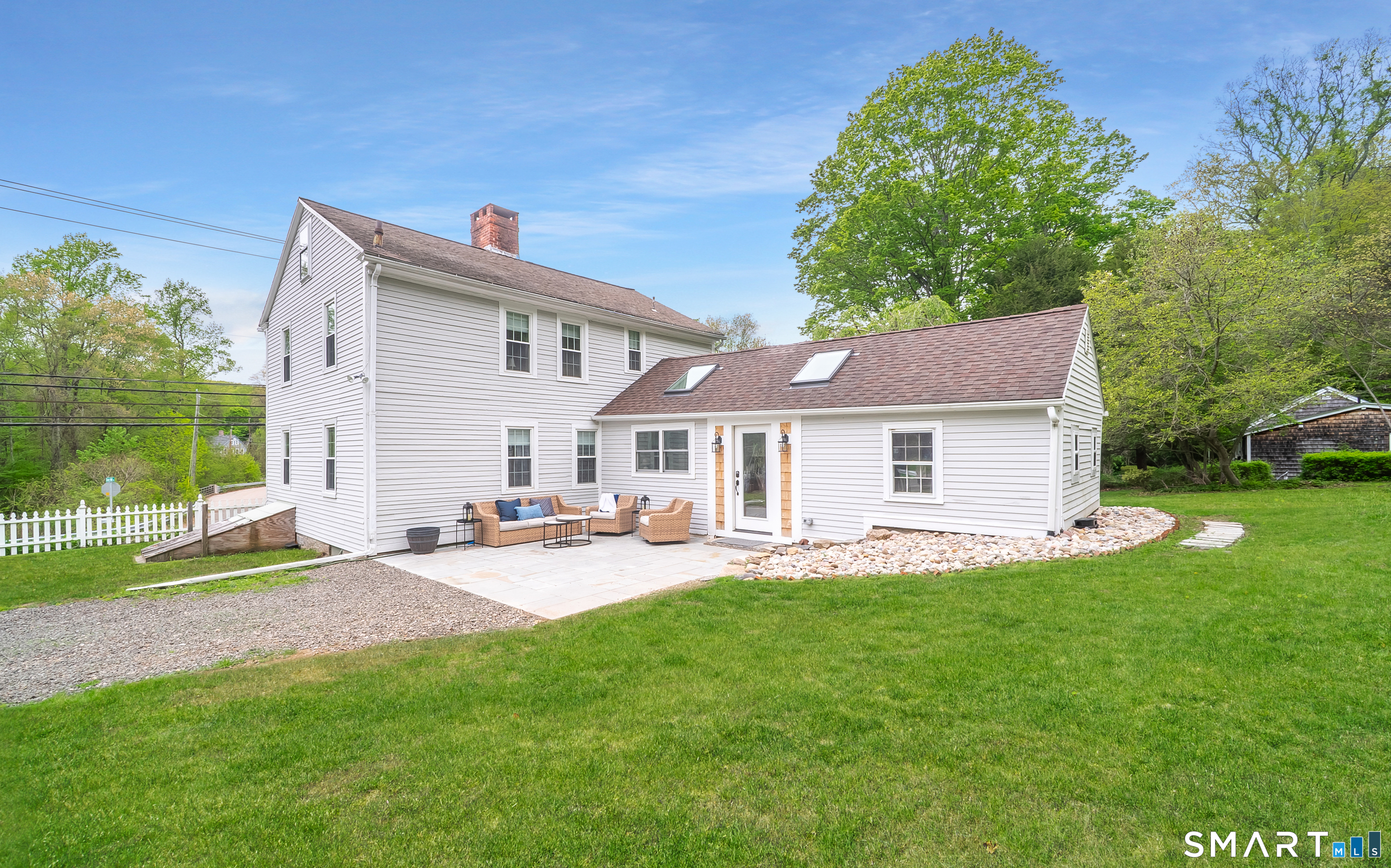230 Killingworth Road Haddam, CT 06441 - Photo 31 of 36 a front view of a house with a garden and outdoor seating