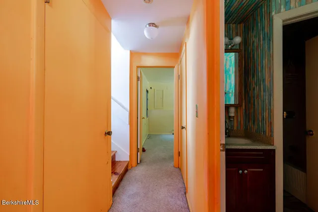 a view of a bathroom from a hallway