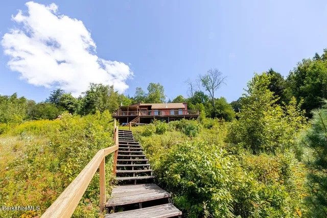 a view of a garden with sitting area