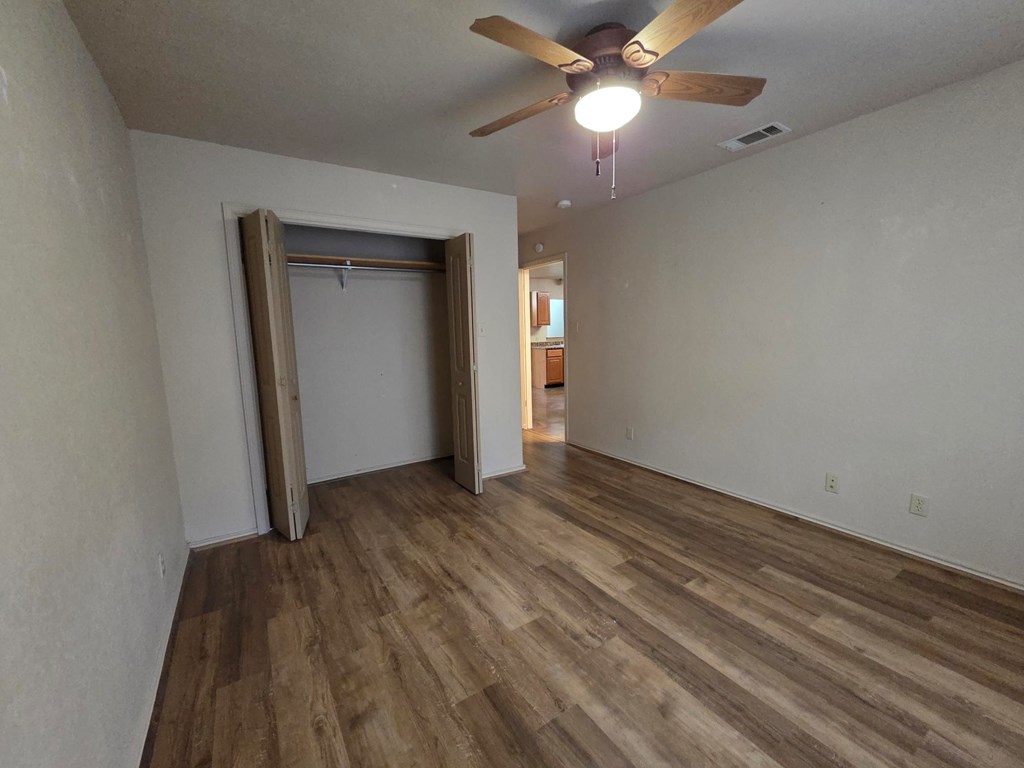 237 Green Oaks Loop Fredericksburg, TX 78624 - Photo 15 of 19 wooden floor in an empty room