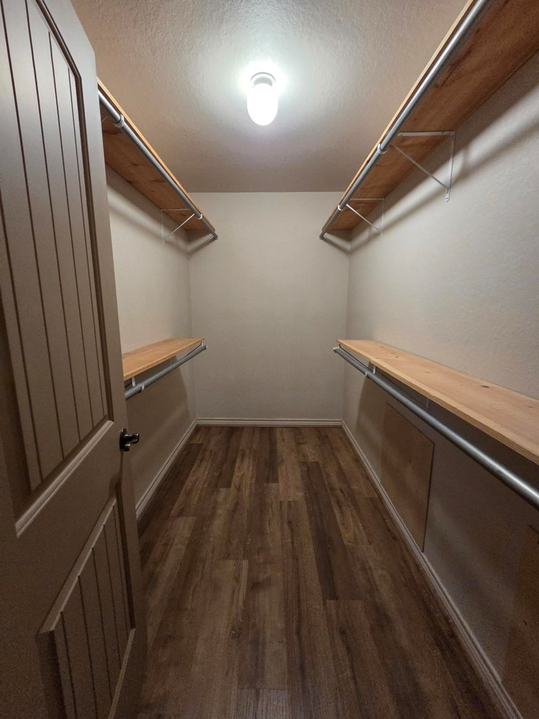 237 Green Oaks Loop Fredericksburg, TX 78624 - Photo 19 of 19 a view of a room with wooden floor