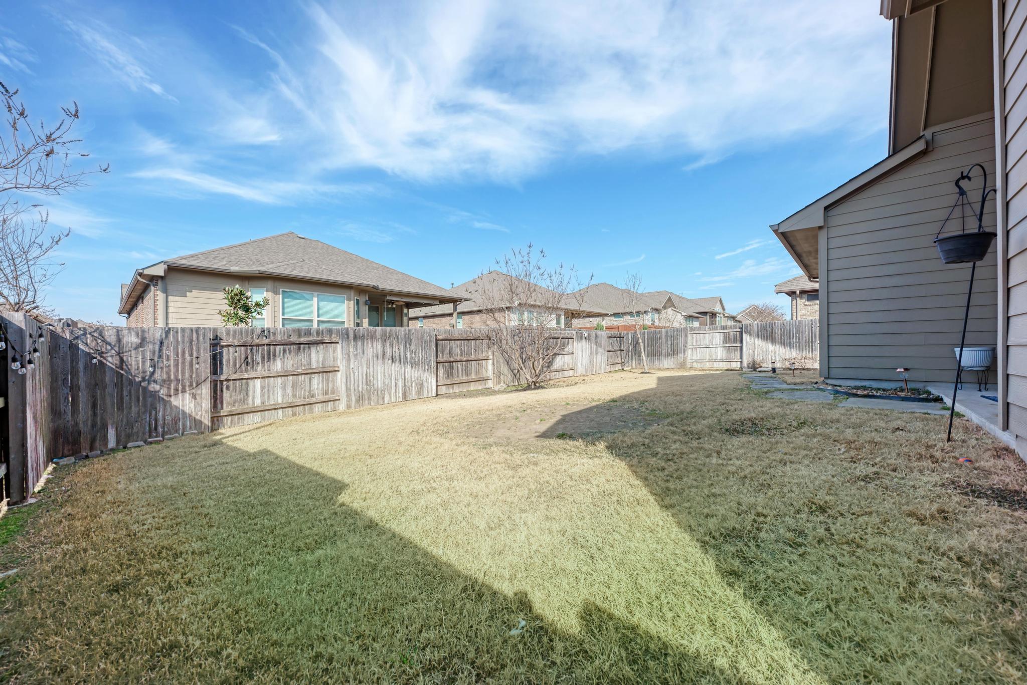 198 Rough Leaf Drive Buda, TX 78610 - Photo 29 of 38 View of fenced backyard