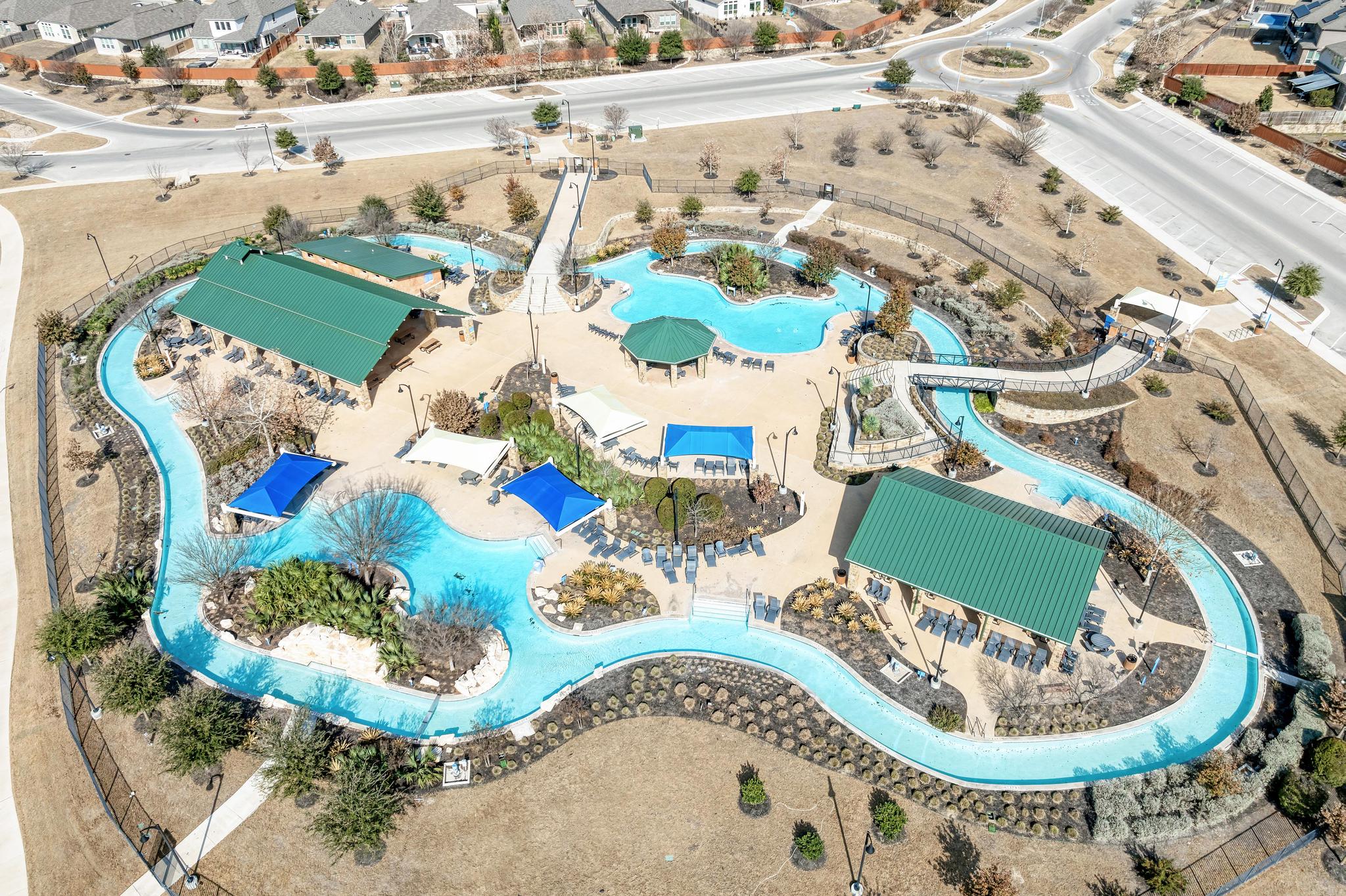 198 Rough Leaf Drive Buda, TX 78610 - Photo 36 of 38 Aerial view of residential area featuring a pool area